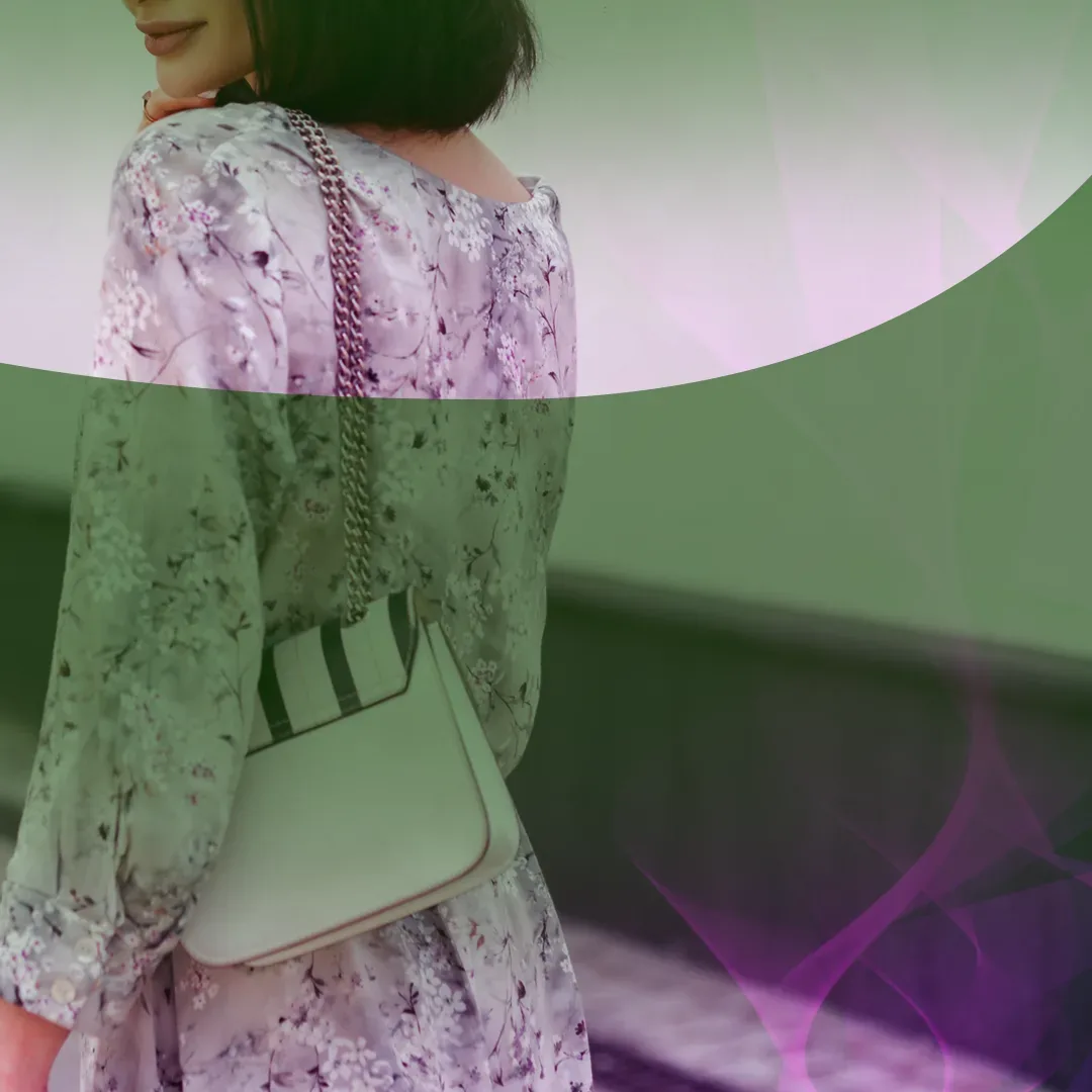 Woman in a floral dress walking with a handbag